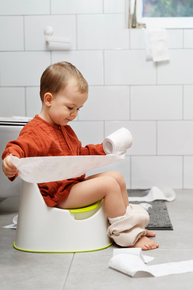 Child playing with toilet paper